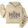 18-1-5.webp This Mom Wears Her Heart on Her Sleeve Hoodie – Personalized Mom Life Shirt with Kids’ Names, Mother’s Day Gift, Cute Blessed Mama Tee