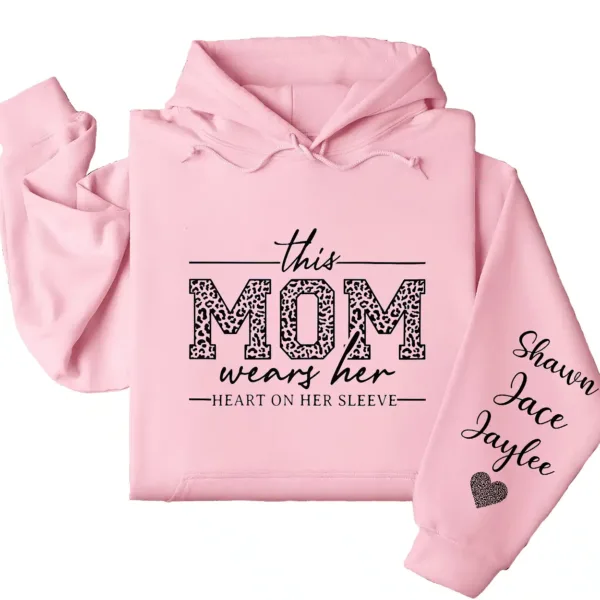 18-5-1.webp This Mom Wears Her Heart on Her Sleeve Hoodie – Personalized Mom Life Shirt with Kids’ Names, Mother’s Day Gift, Cute Blessed Mama Tee