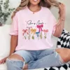 20-3-6.webp She Is Mom T-Shirt – Retro Coquette Bow Christian Mom Shirt, Bible Verse 'She Is Strong' Tee, Cute Mother's Day Gift for Faithful Mama