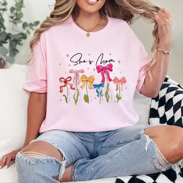 20-3-6.webp She Is Mom T-Shirt – Retro Coquette Bow Christian Mom Shirt, Bible Verse 'She Is Strong' Tee, Cute Mother's Day Gift for Faithful Mama