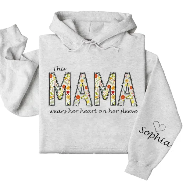 7-1-9.webp This Mama Wears Her Heart on Her Sleeve Hoodie – Floral Hoodie for Mom with Kids’ Names, Cute Personalized Gift Idea