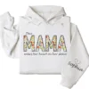7-3-9.webp This Mama Wears Her Heart on Her Sleeve Hoodie – Floral Hoodie for Mom with Kids’ Names, Cute Personalized Gift Idea