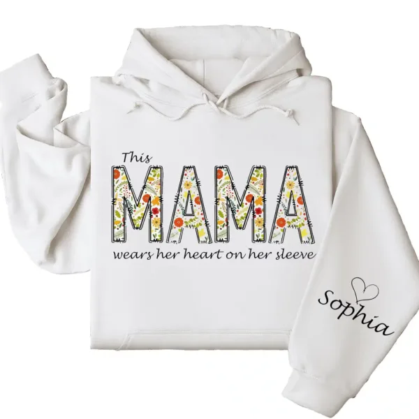 7-3-9.webp This Mama Wears Her Heart on Her Sleeve Hoodie – Floral Hoodie for Mom with Kids’ Names, Cute Personalized Gift Idea
