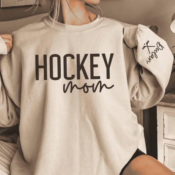 CUSTOM-Hockey-Mom-Sweatshirt-with-Name-on-Sleeve-Ice-Hockey-Mama-Sweater-Personalized-Hockey-Gift-Game-Day-Crewneck-Goalie-Mom-Hoodie-1.png Custom Hockey Mom Sweatshirt with Name on Sleeve, Personalized Mom Sweater, Game Day Shirt, Crewneck, Mothers Day Gift