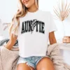 Cropped-Checkered-Auntie-Shirt-4.webp Auntie T-Shirt With Flash, Cute Auntie Shirts, Gift for Aunt, Pregnancy Reveal to Aunt Cool Aunt Club