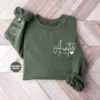 Custom-Auntie-Sweatshirt-3.webp Custom Auntie Sweatshirt, Personalized Aunt Sweatshirt With Nieces Nephews Names On Sleeve, Pregnancy Reveal Outfit, Mothers Day Clothing Gifts