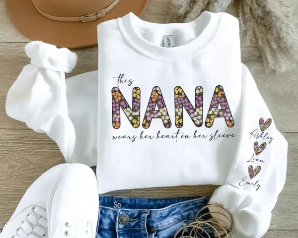 Custom This Nana Wears Her Heart On Her Sleeve Sweatshirt, Personalized Nana Sweatshirt With Grandchildren Names, Grandma Shirt with Names On Sleeve