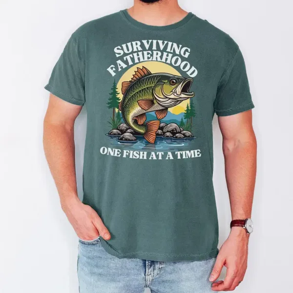 Fatherhood-Fishing-3.webp Fatherhood Fishing T-Shirt, funny Bass Tee, Surviving Fatherhood, Fishing Enthusiast, The Best Father's Day Gift