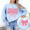 Gigi-Nana-And-Kids-Lovely-Bow-Personalized-Sweatshirt-With-Design-On-Sleeve-Meaningful-Valentine-Gifts-For-Grandma-Mom-Wife-NH96-2-1.png Gigi And Kids Lovely Bow - Personalized Sweatshirt With Design On Sleeve - Meaningful Mother's Day Gifts For Grandma, Mom, Wife