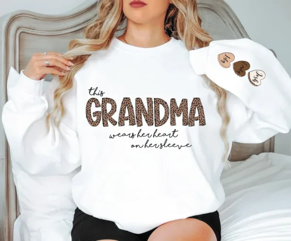 Personalized-Grandma-Sweatshirt-With-Kids-Names-Grandma-Crewneck-I-Wear-My-Heart-On-My-Sleeve-Grammy-Sweater-Gift-from-Grand-Kids-2.png Personalized This Grandma Wears Her Heart on Her Sleeve Sweatshirt, Custom Kids Name on Sleeve, Mothers Day Gift, Gift for Grandma Sweatshirt