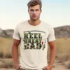 Reel-Great-Dad-Shirt-Fisher-Daddy-Shirt-2.webp Reel Great Dad, Fisher Daddy T-Shirt, Funny Fishing Dada Shirt, Camouflage Reel Great Daddy Shirt, Fathers Day Gift, Gift For Fisher Dad