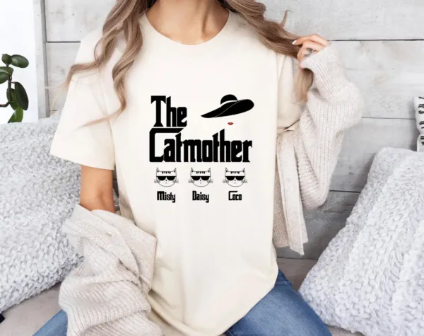 The-Catmother-T-Shirt-Cat-Mum-T-Shirt-Cat-Mama-Tee-Cat-Lovers-Top-Funny-Cat-Mum-Tshirt-Personalized-Cat-Names-Tee.webp The Catmother T-Shirt, Cat Mum T Shirt, Cat Mama Tee, Cat Lovers Top, Funny Cat Mum T-shirt, Personalized Cat Names Tee