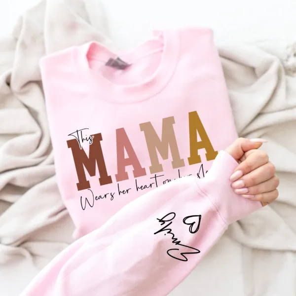 This-Mama-Wears-Her-Heart-on-Her-Sleeve-Sweatshirt-Personalized-Kids-Name-on-Sleeve-Mothers-Day-Gift-Gift-for-Mom-Sweatshirt-Mom-Life-2.png Personalized This Mama Wears Her Heart on Her Sleeve Sweatshirt, Custom Kids Name on Sleeve, Mothers Day Gift, Gift for Mom Sweatshirt, Mom Life